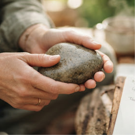 Holding a smooth stone during the grounding exercise